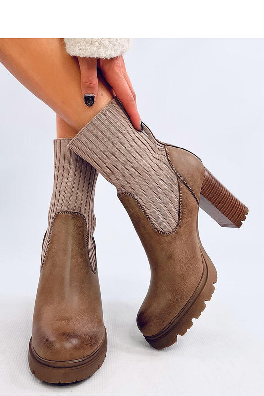 Stylish Inello women's heel boots showcasing a modern sock design with soft fur lining, perfect for comfort and elegance.