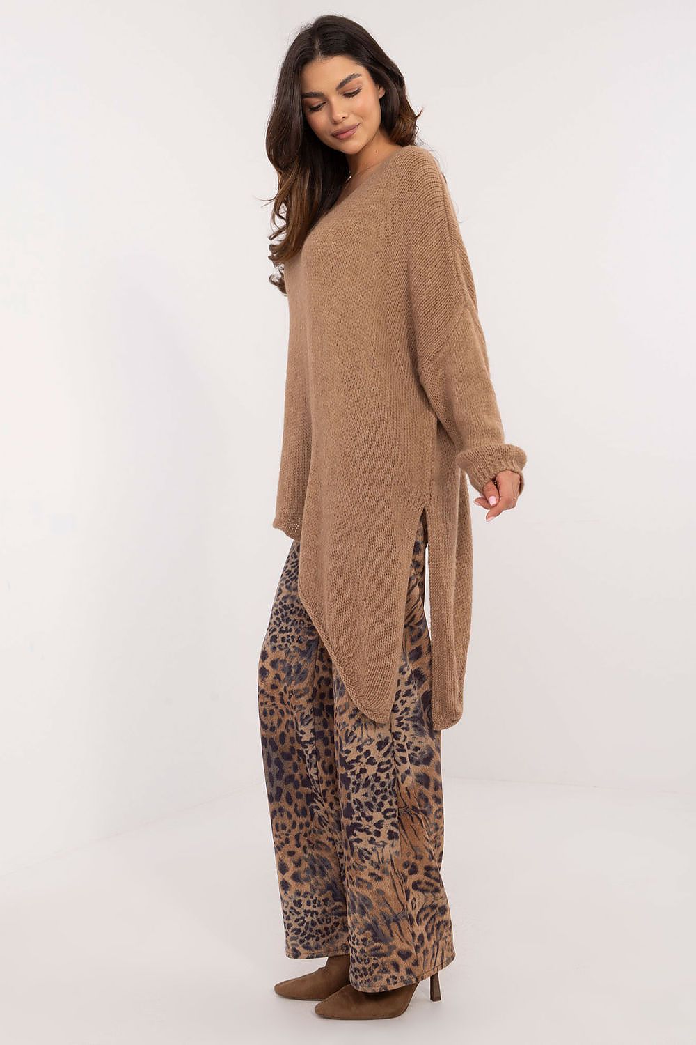 Och Bella Women's Asymmetrical Hem Sweater laid flat, showcasing the unique asymmetrical hem and premium materials for a luxurious fashion statement.