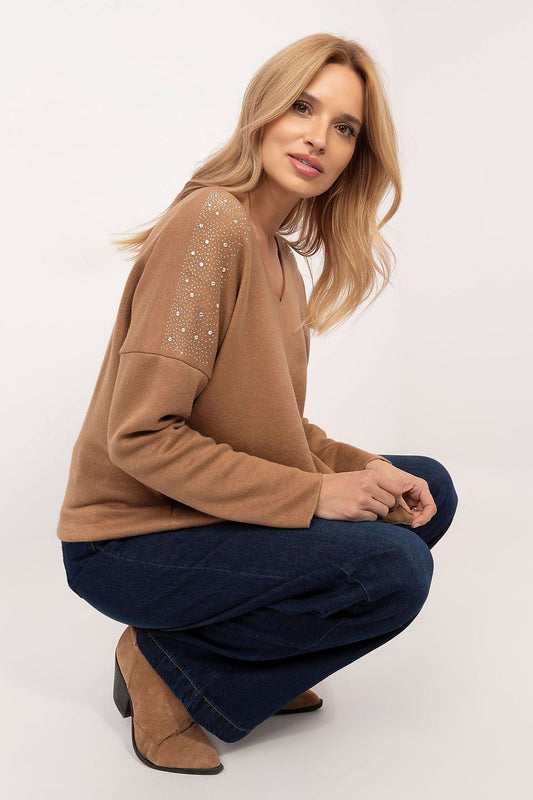 Close-up of the luxe rhinestone detailing on the shoulder of Italy Moda's women's sweater, adding a touch of glamour to everyday wear.