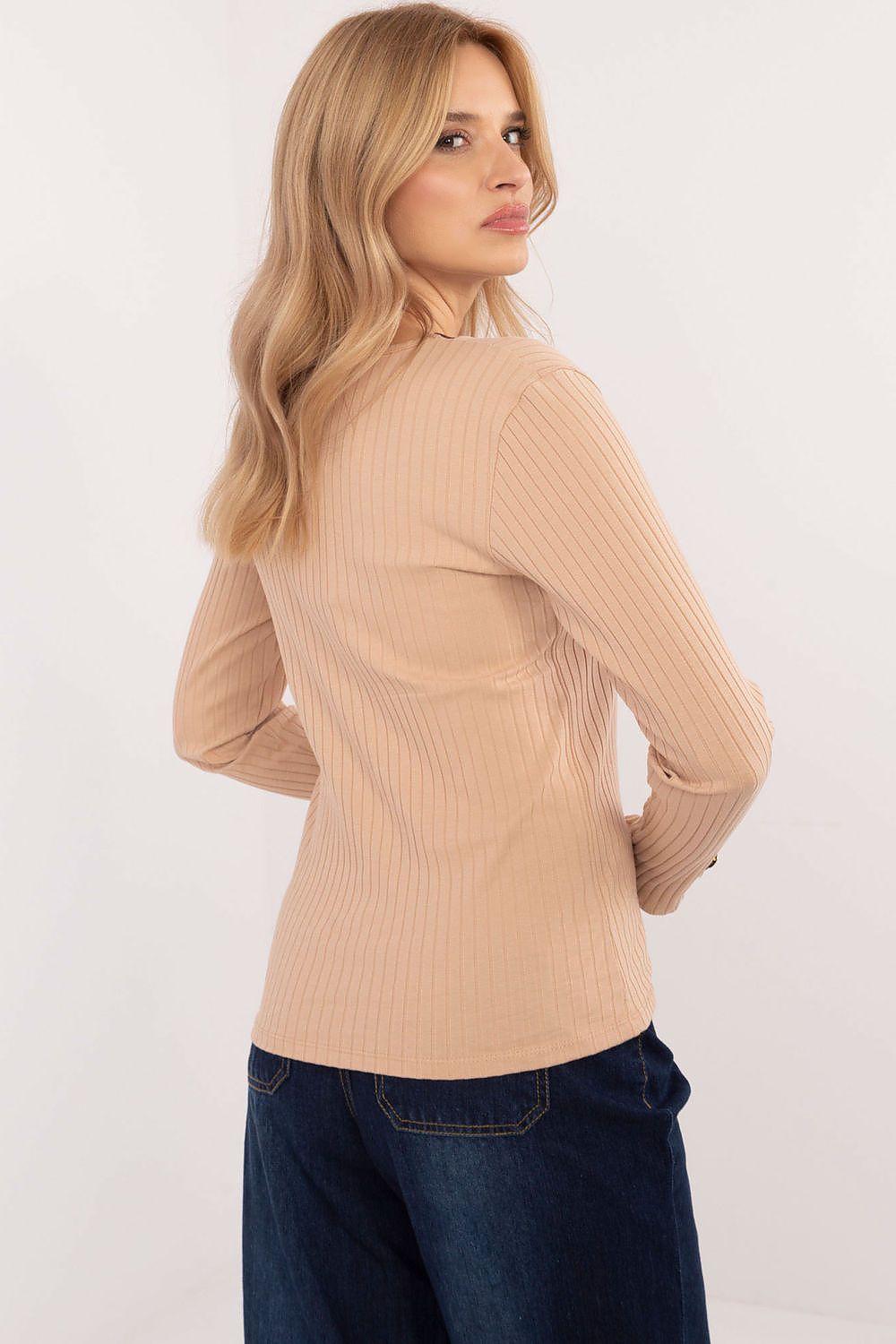 Back view of Relevance's elegant ribbed blouse, highlighting the smooth design and luxurious fabric blend, tailored for a perfect fit.
