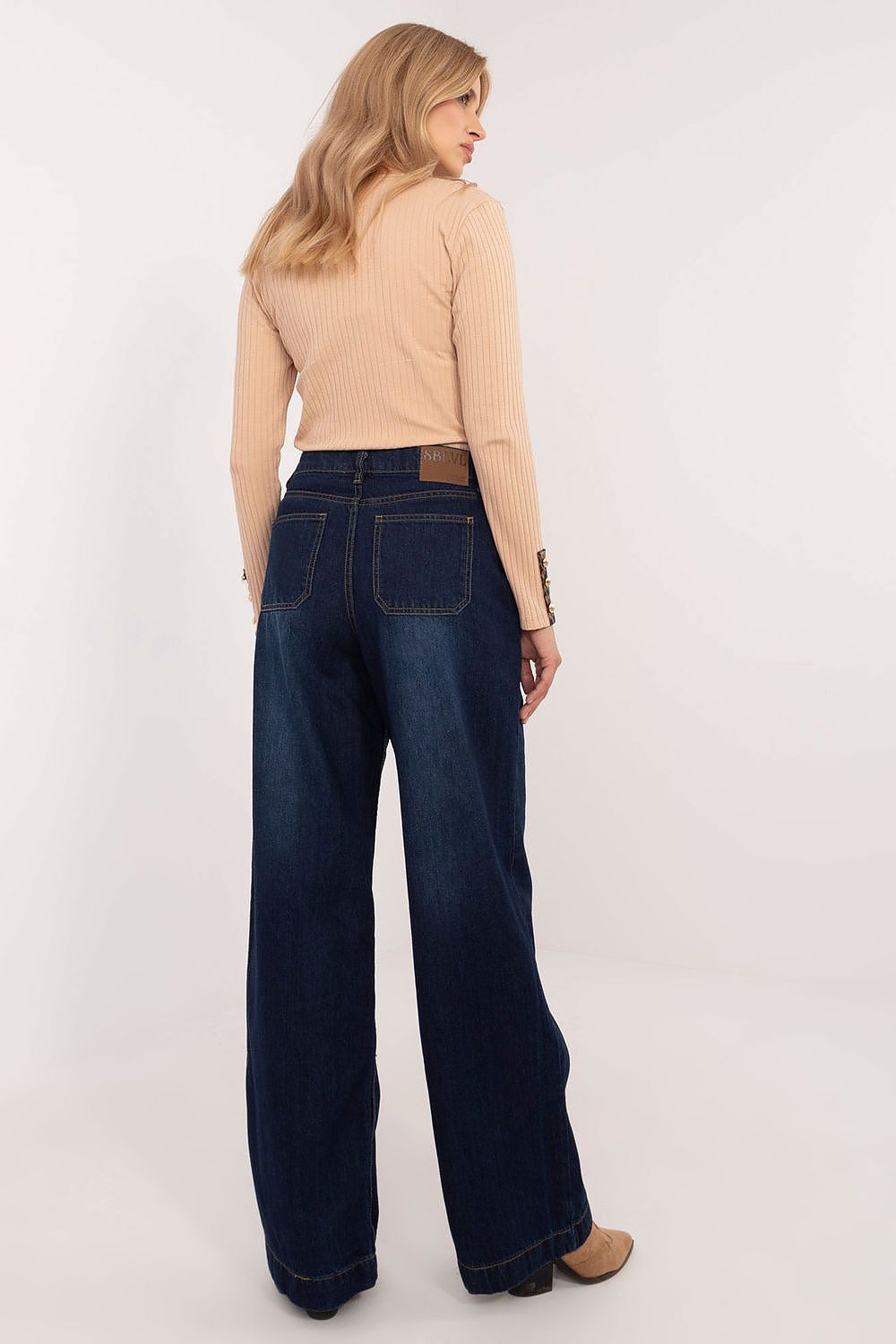 Sublevel's exquisite high-waist wide-leg denim pants, combining comfort and style, ideal for fashion-forward individuals seeking elegance.