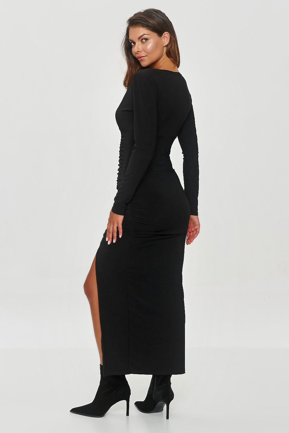 Stylish black evening dress by Makadamia featuring a V-neck, elegant ruching, and a daring front slit, perfect for sophisticated occasions.