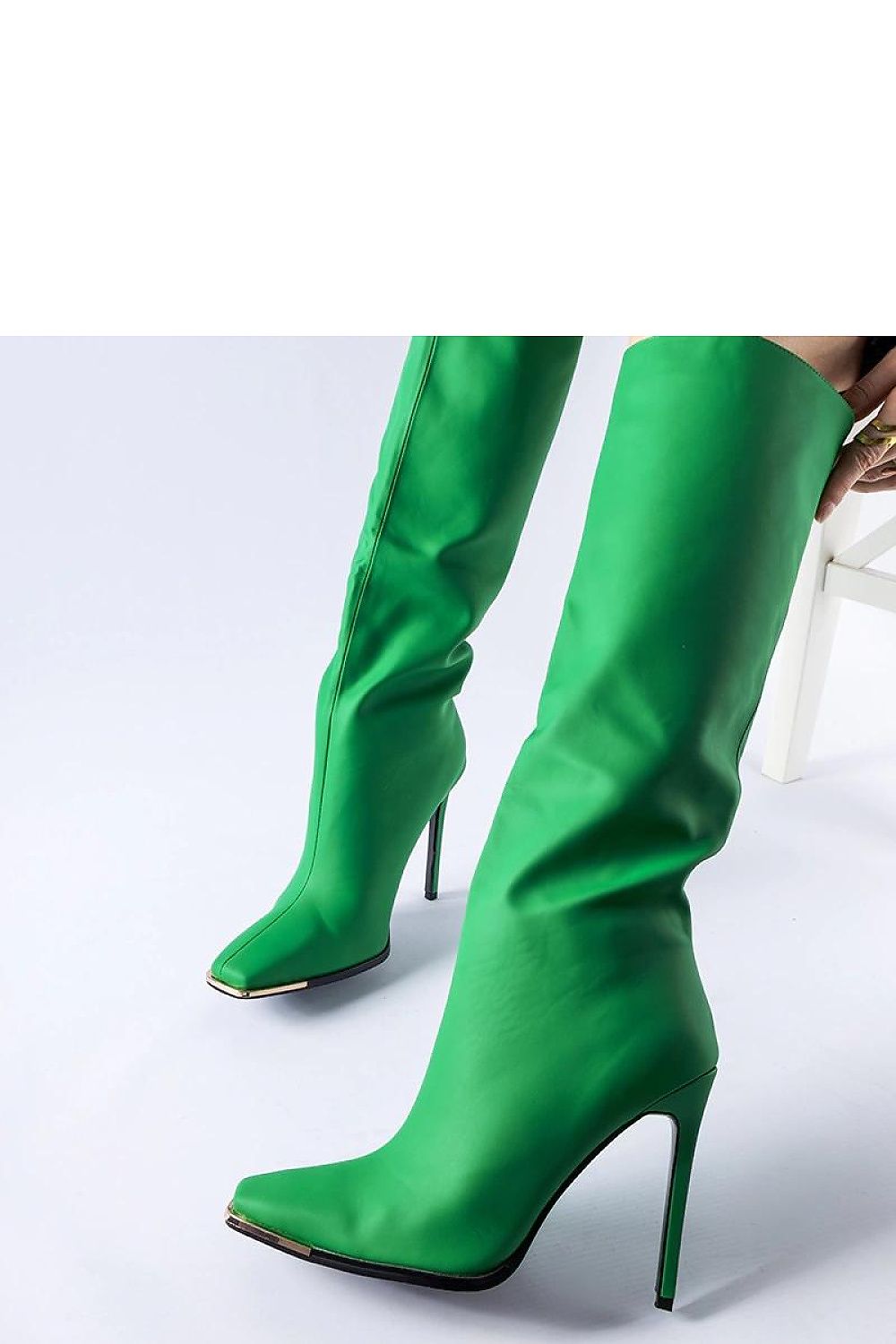 Luxurious green heeled boots for women, offering timeless elegance and warmth for winter, designed by Solea.