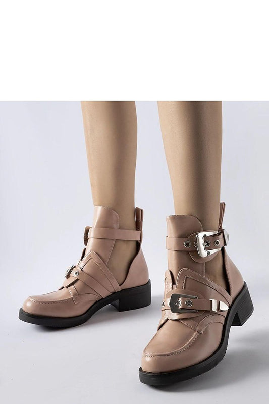Elegant Solea Pink Sperone Cutout Boots featuring a practical buckle and chic cutouts, combining fashion and functionality for cold weather, available in eco-friendly leather.