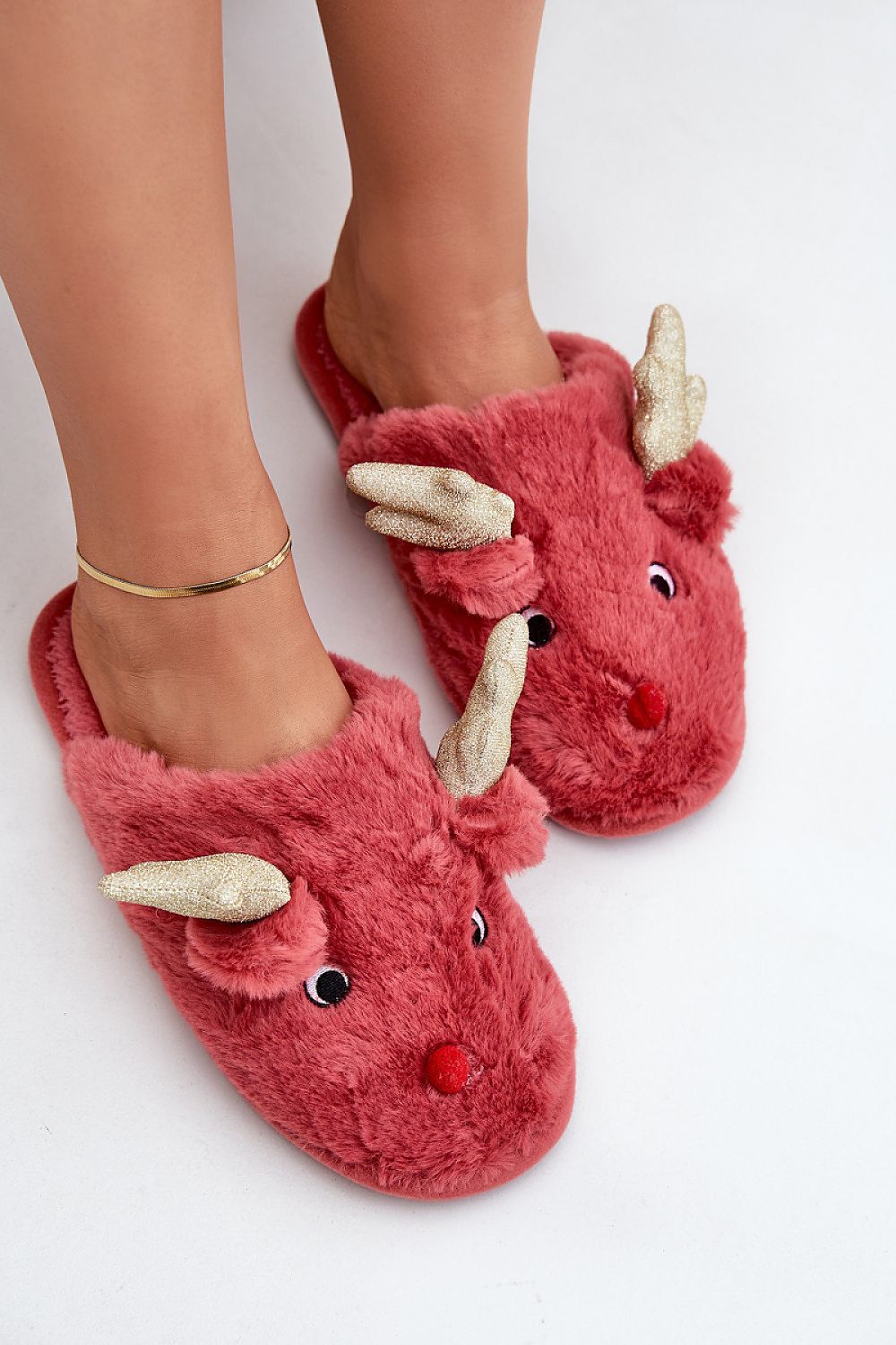 Charming and comfortable women's fur slippers with a reindeer design, brought to you by Step in Style for an exquisite winter experience.