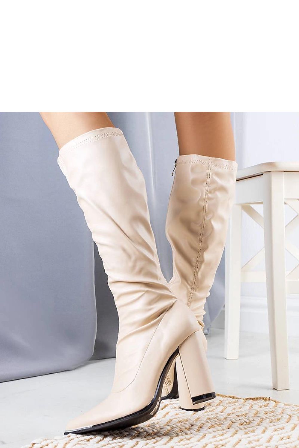 Chic beige Velass stiletto boots for women with a sophisticated silhouette and zipper closure, designed for comfort and elegance by Solea.