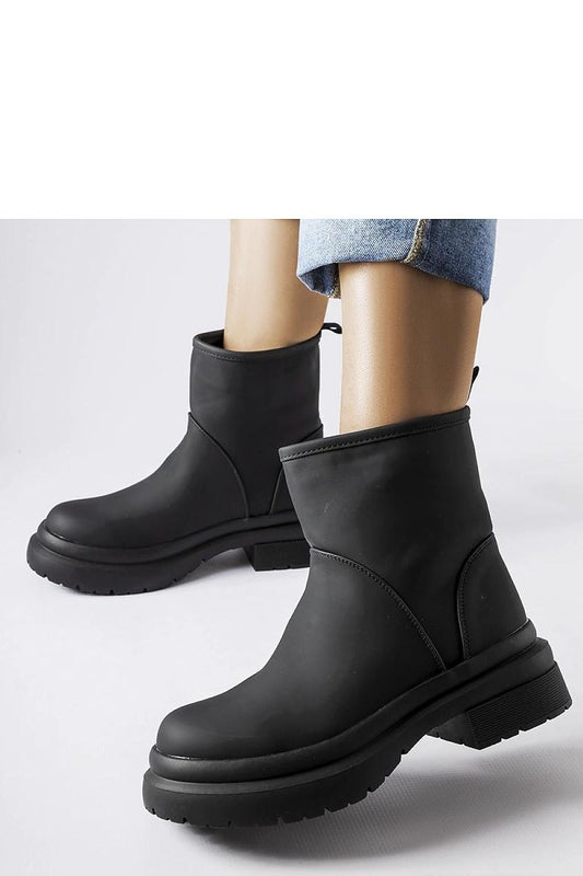 Chic Solea Clotilde Black Insulated Rubber Ankle Boots showcasing thermal comfort and waterproof features, ideal for fashionable winter outings.