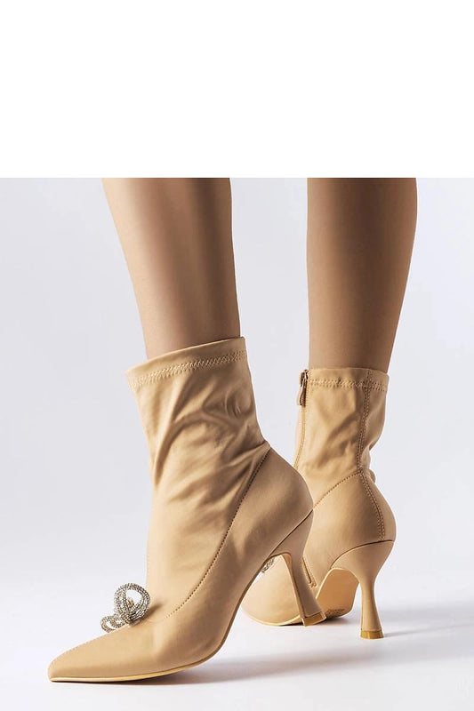 Close-up of Solea rhinestone bow ankle boots in elegant beige, highlighting high-quality fabric and side zipper for easy wear in chic fall styles.
