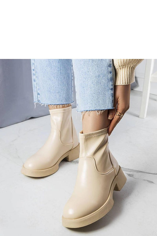 Solea women's ankle boots in beige faux leather, featuring a thick durable rubber sole and stylish minimalist design, ideal for classic fashion.