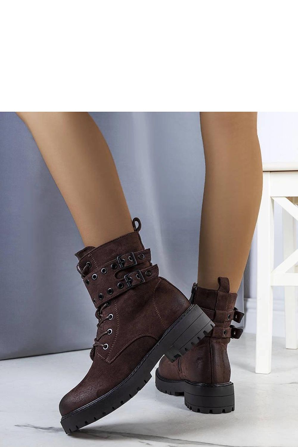 Elegant Solea Fallkirk insulated ankle boots in dark brown, showcasing a zipper closure and lace-up front, designed for luxury wear in cooler months.