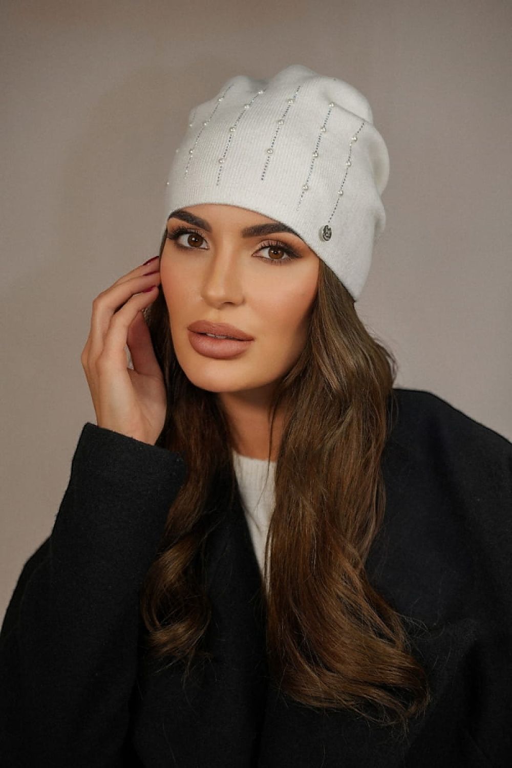 Kamea Altair Women's Hat elegantly styled with delicate pleats, highlighting its luxury feel and exquisite pearl embellishments.