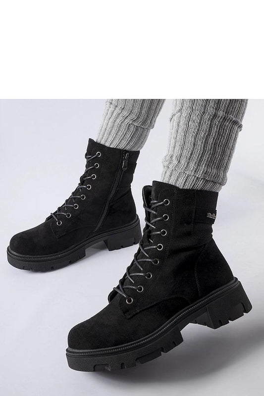 Detailed view of Solea's Black Eco-Suede Cunha Boots highlighting the quality eco-leather fabric, flat heel design for comfort, and stylish lacing suitable for various sophisticated outfits.
