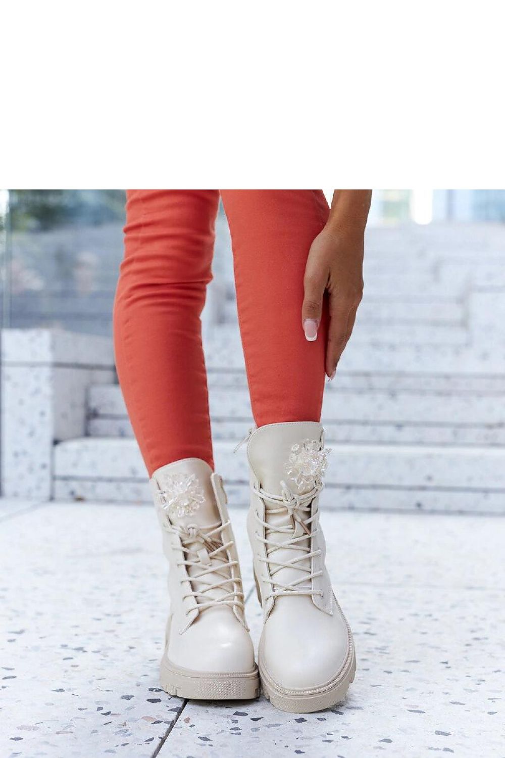 Accadia beige insulated lace-up boots displayed elegantly with decorative beads, a luxurious choice from Solea.