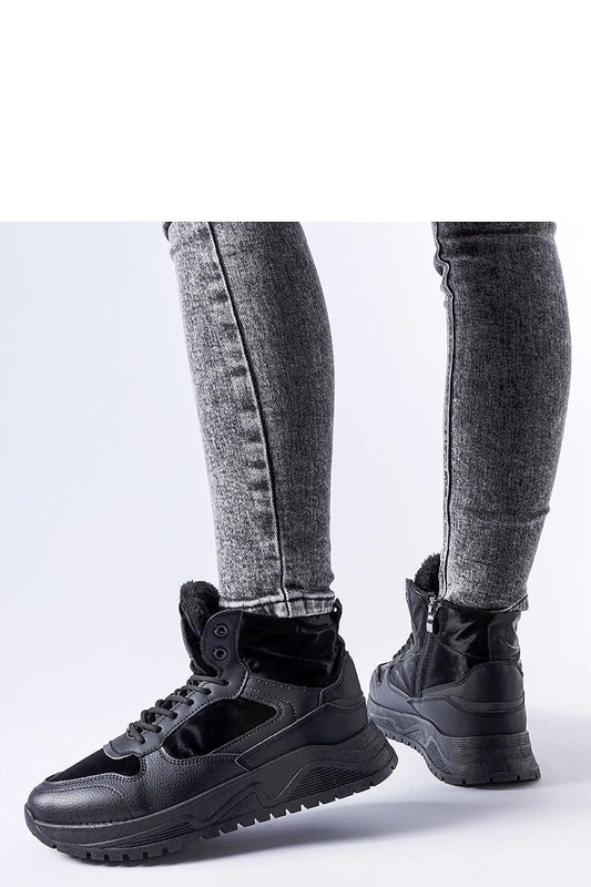 Close-up of Solea black insulated high-top Malles sneakers highlighting the quality rubber material and intricate detailing.