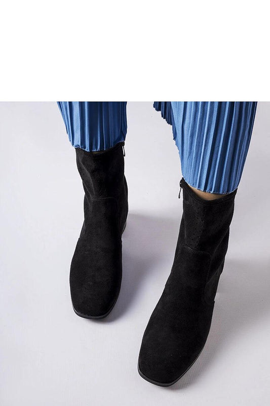 Stylish black eco leather heel boots by Solea with a comfortable zip design, showcasing luxury and comfort.