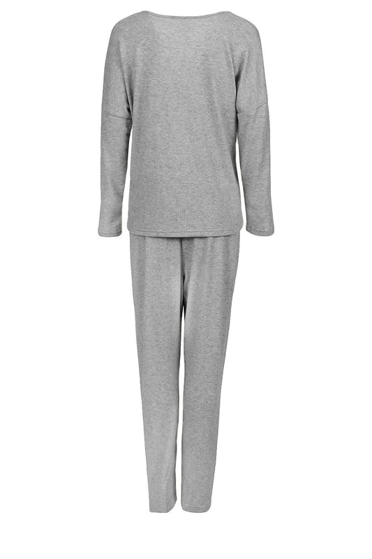 Luxurious women's two-piece pajamas set in elegant design, oversized comfort, crafted by Momenti Per Me, showcasing delicate colours and high-quality fabric for stylish homewear.