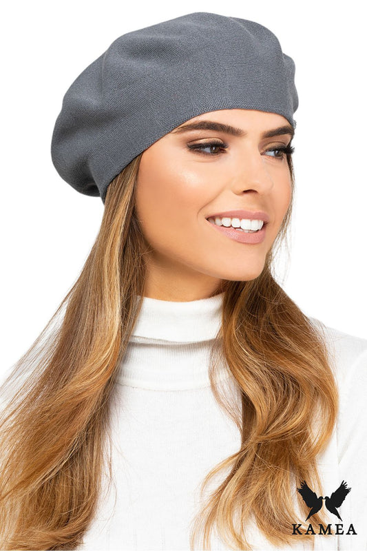 Premium coral women’s beret by Kamea, an elegant viscose fashion accessory featuring a soft texture and a silver logo, perfect for stylish looks in cool spring and autumn weather.