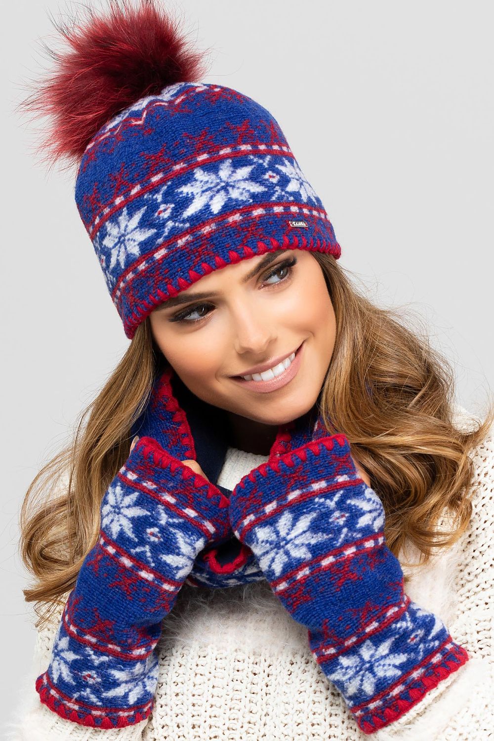 Luxurious Kamea Annapolis Women's Hat and Scarf Set, showcasing a soft design with intricate snowflake motifs and a chic fluffy pompom for added warmth and style.