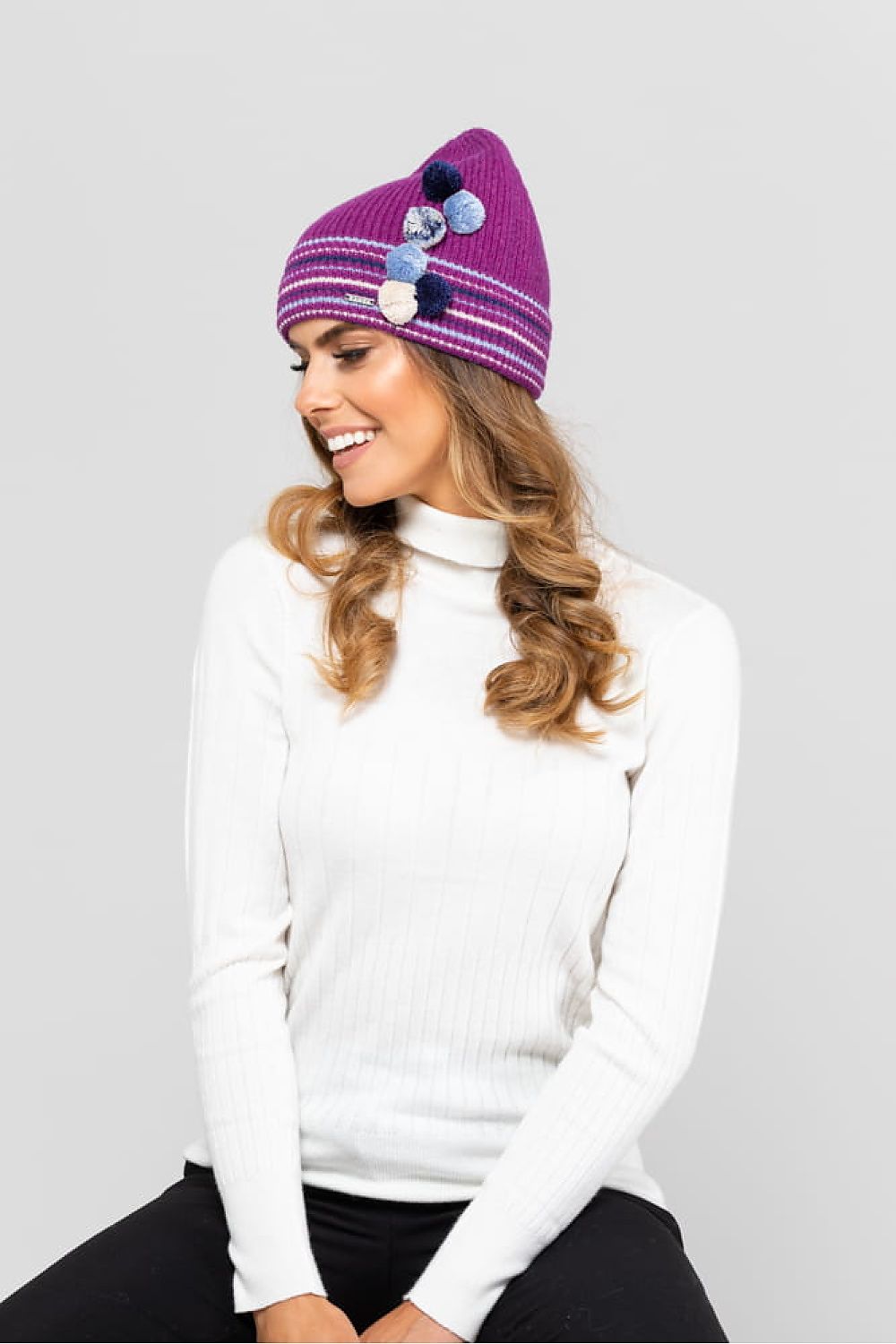 Chic Kamea Colorado Youth Hat designed with soft wool blend and charming fuchsia pom-poms, a luxurious accessory for fashionable young girls.