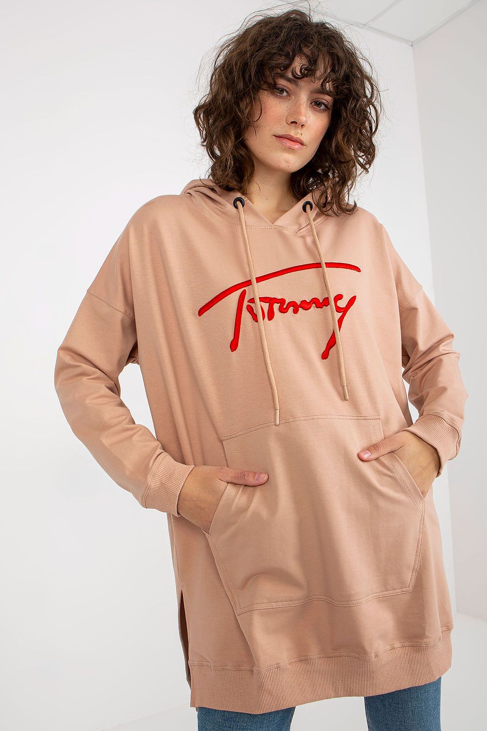 Close-up of the luxury women's long casual sweatshirt by Factory Price, showcasing the high-quality cotton blend fabric, minimalist design, and stylish patch detail.