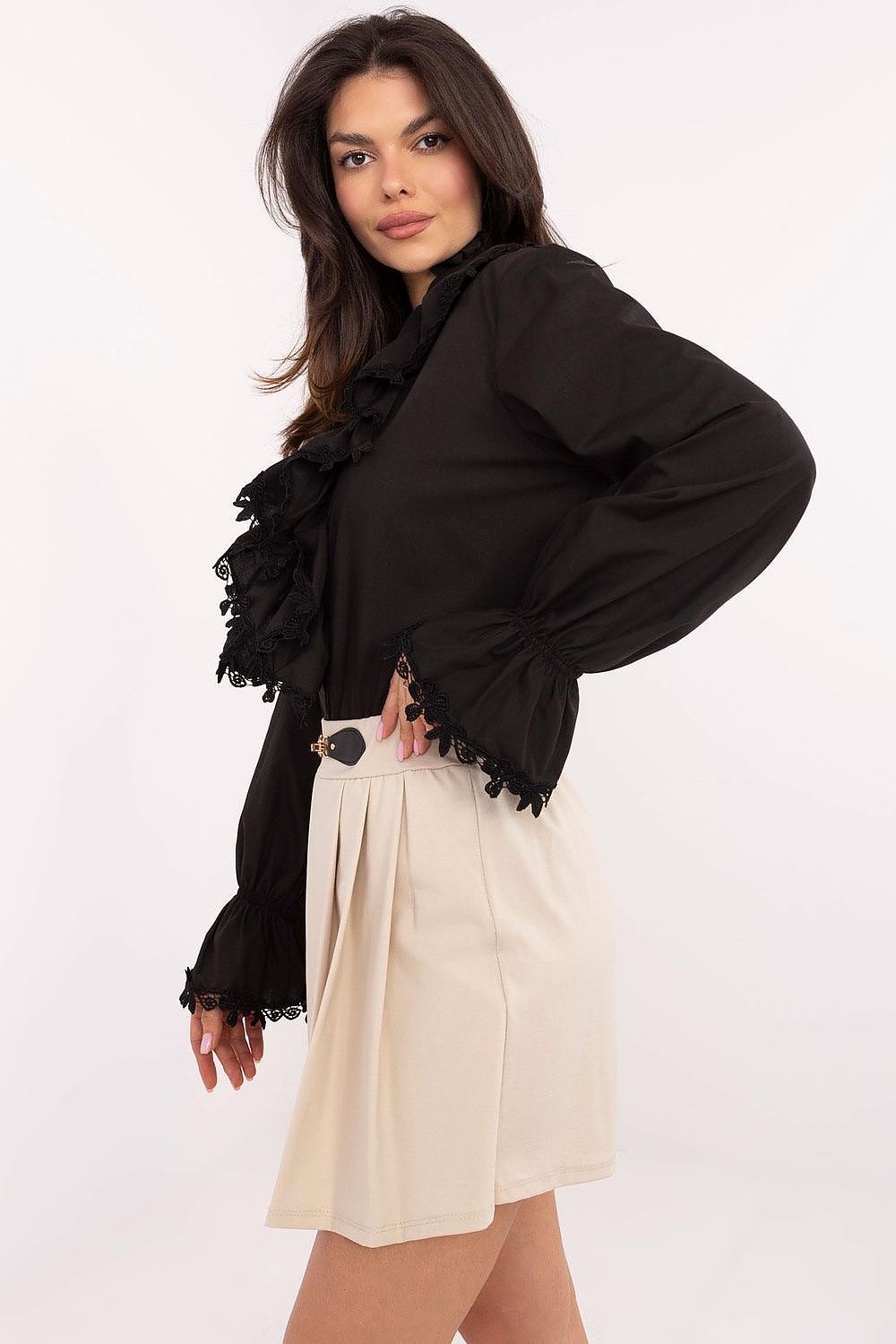 Stylish woman wearing Italy Moda elegant skirt pants, demonstrating versatility from formal to casual styles in a chic pleated design.