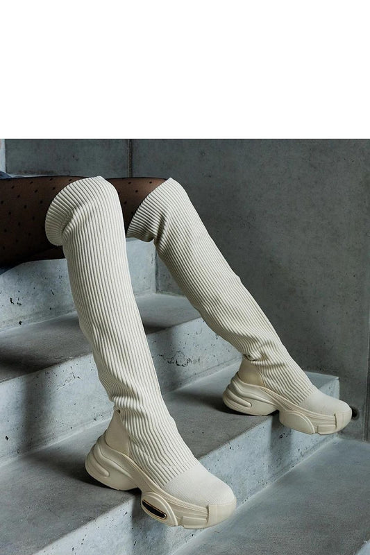 Close-up view of Solea beige thigh-high boots showcasing the premium textile material and slip-on design, ideal for chic autumn and winter styling.