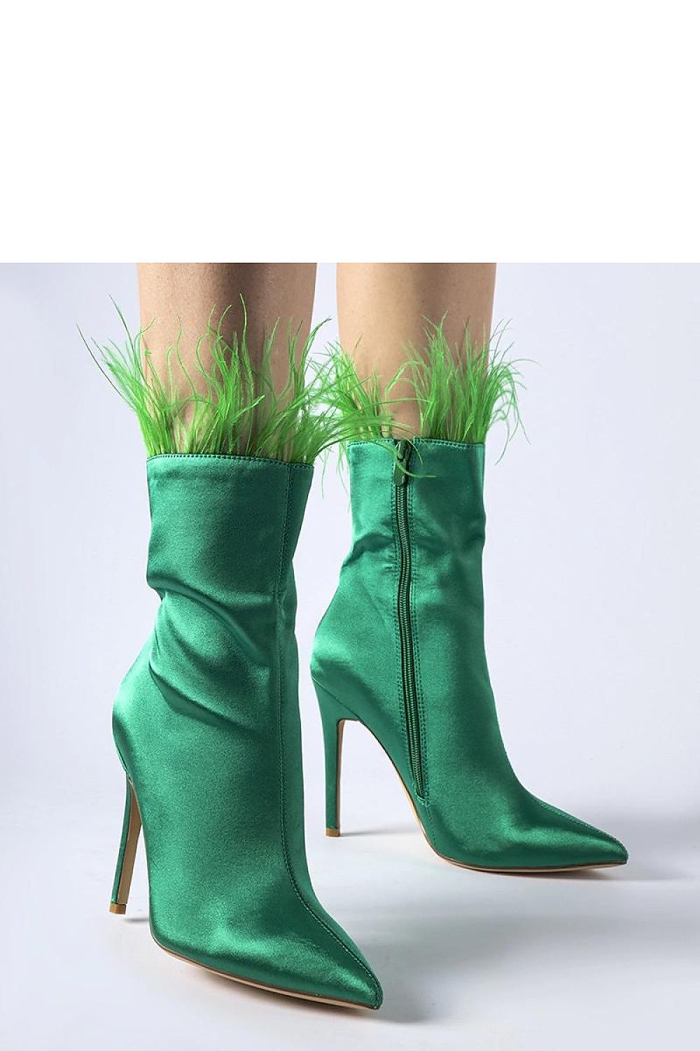Chic Solea Selvena ankle boots in green, designed with a pointed toe and feather detailing, ideal for both casual and formal occasions.