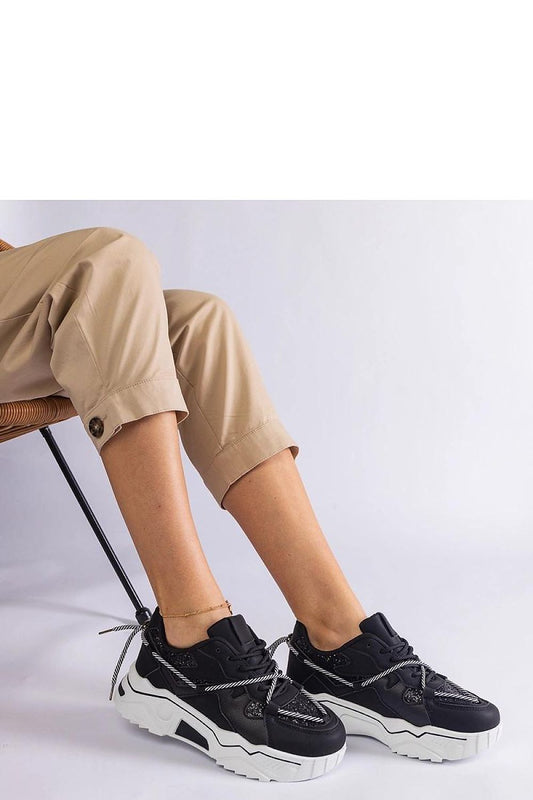 Solea women's luxurious black sneakers featuring shimmering brocade details, designed for a comfortable fit and stylish everyday wear.