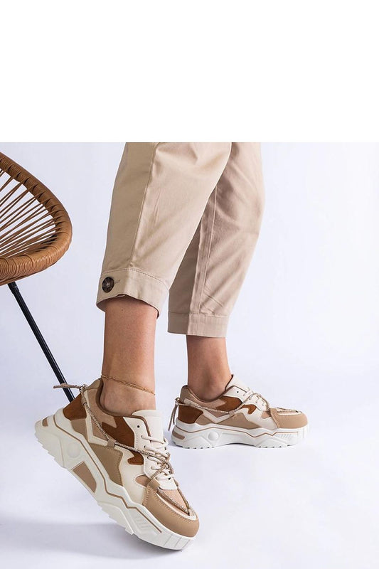 Close-up of the high-quality synthetic leather of Solea's luxury brown sneakers, showcasing the elegant design and exquisite zirconia lace details.