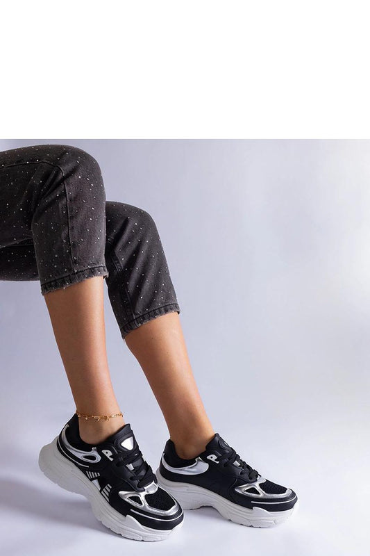 Elegant Solea black women's sneakers showcasing silver accents, designed for comfort and style, featuring a lace-up closure for a secure fit.