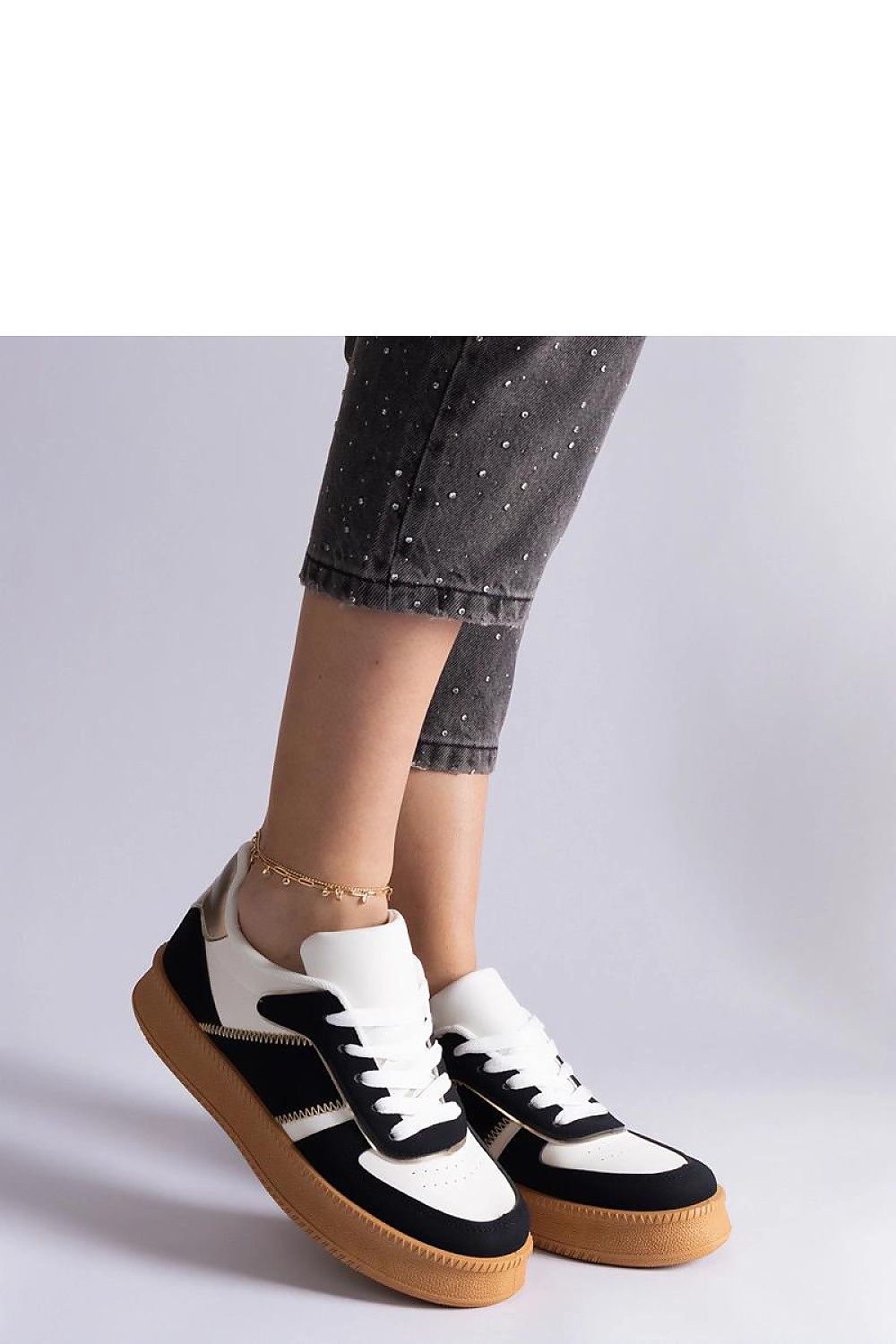 Close-up of Solea Black Vegan Leather Platform Sneakers featuring a sleek black finish and comfortable design, perfect for enhancing any chic outfit.