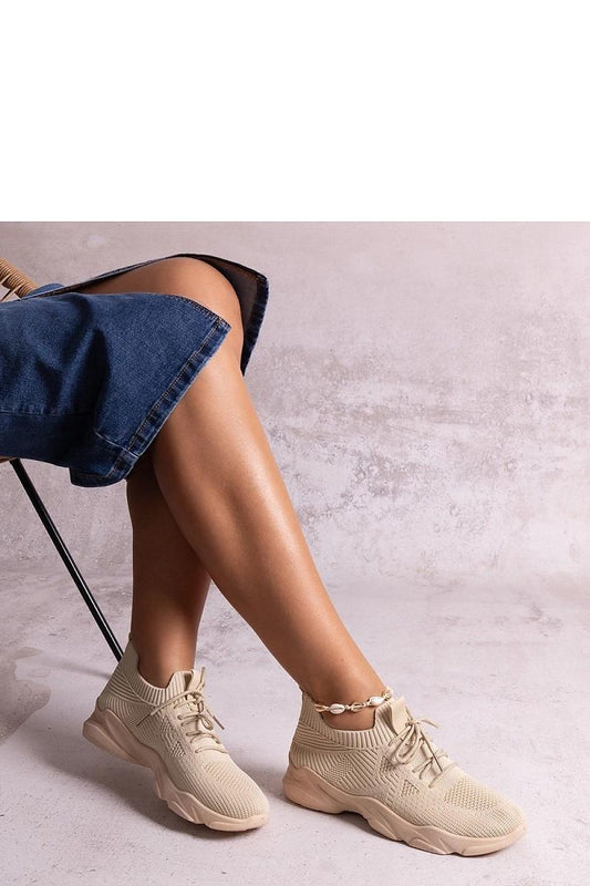 Close-up of Solea beige fabric sneakers highlighting the round toe and medium-height heel, ideal for chic summer outfits.