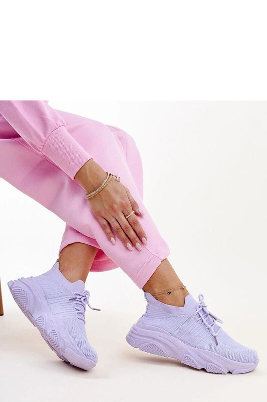 Solea women’s purple slip-on sneakers showcasing a modern rounded toe and chic overall design, ideal for fashion-forward individuals seeking comfort and elegance.