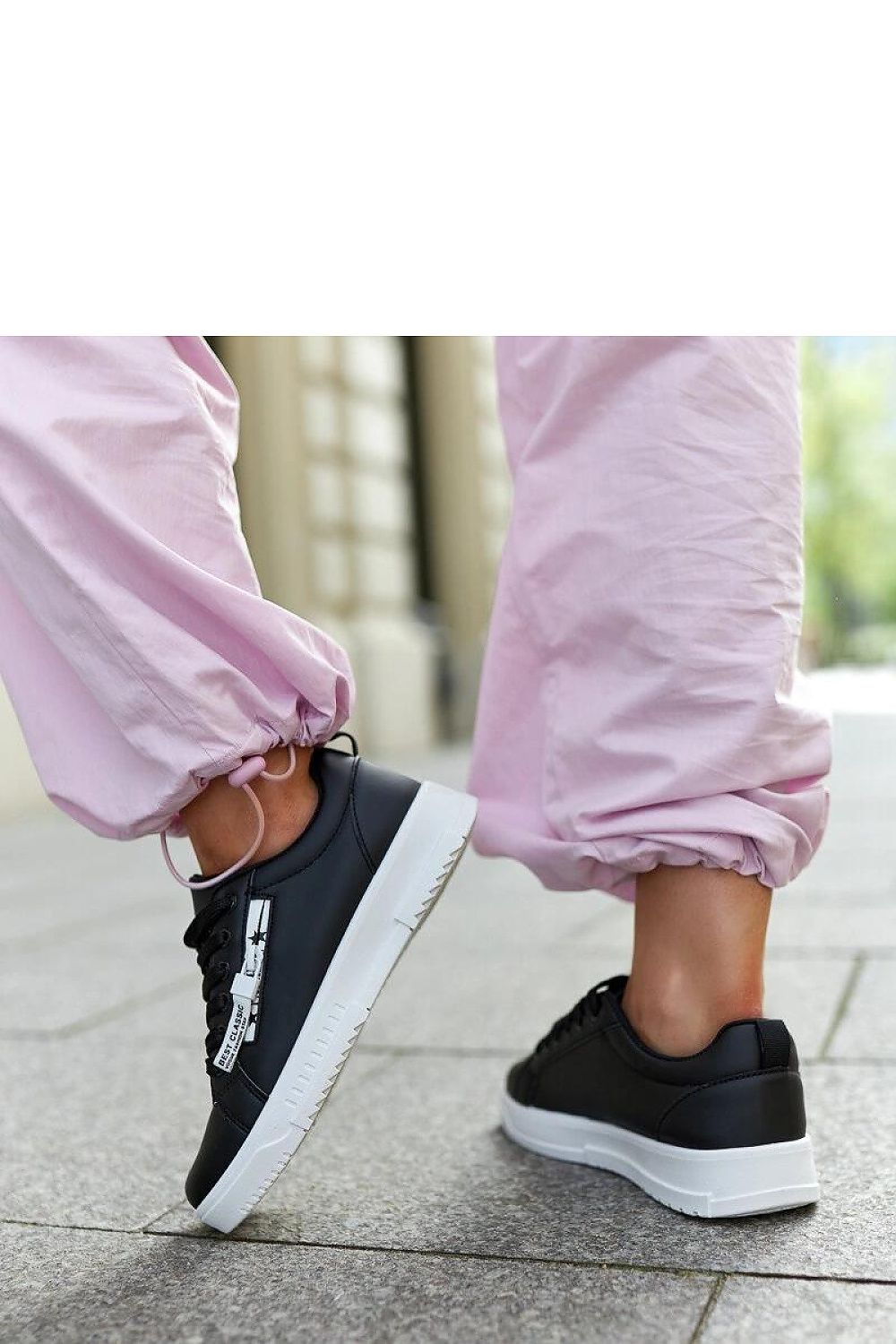 Close-up of Solea eco-leather sneakers, highlighting the chic low cut and round toe, crafted for luxury and durability.