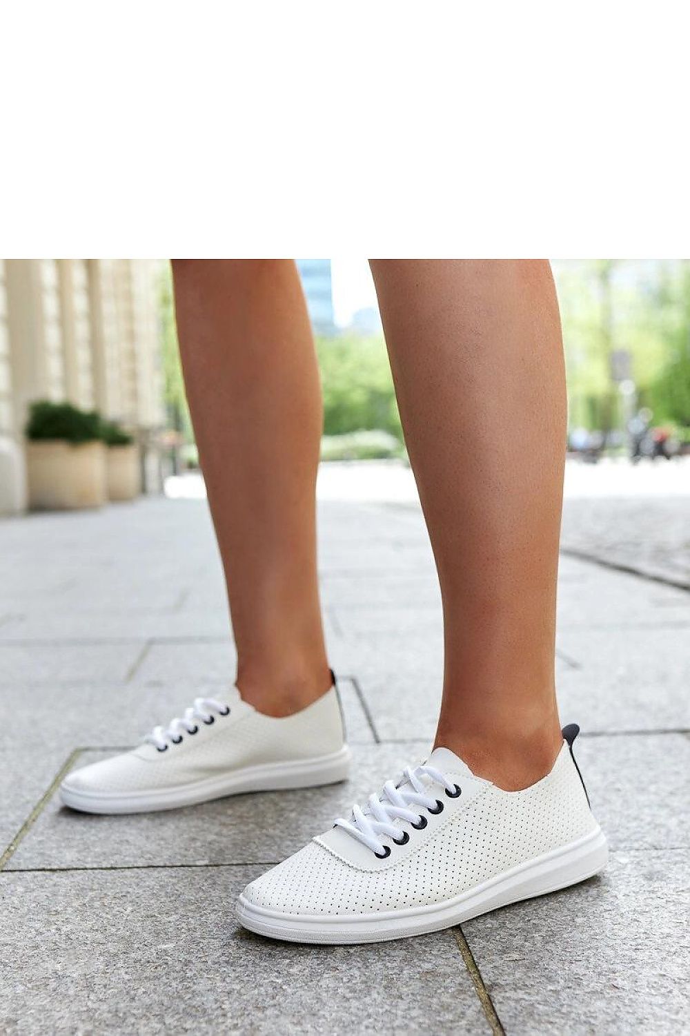 Close-up of Solea white lace-up sneakers Katinka, highlighting the intricate detailing and premium rubber sole for elevated comfort and luxury wear.