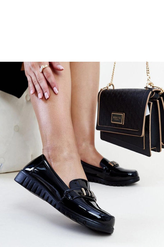 Elegant black patent loafers by Solea with an almond-shaped toe, ideal for fashion-forward women.