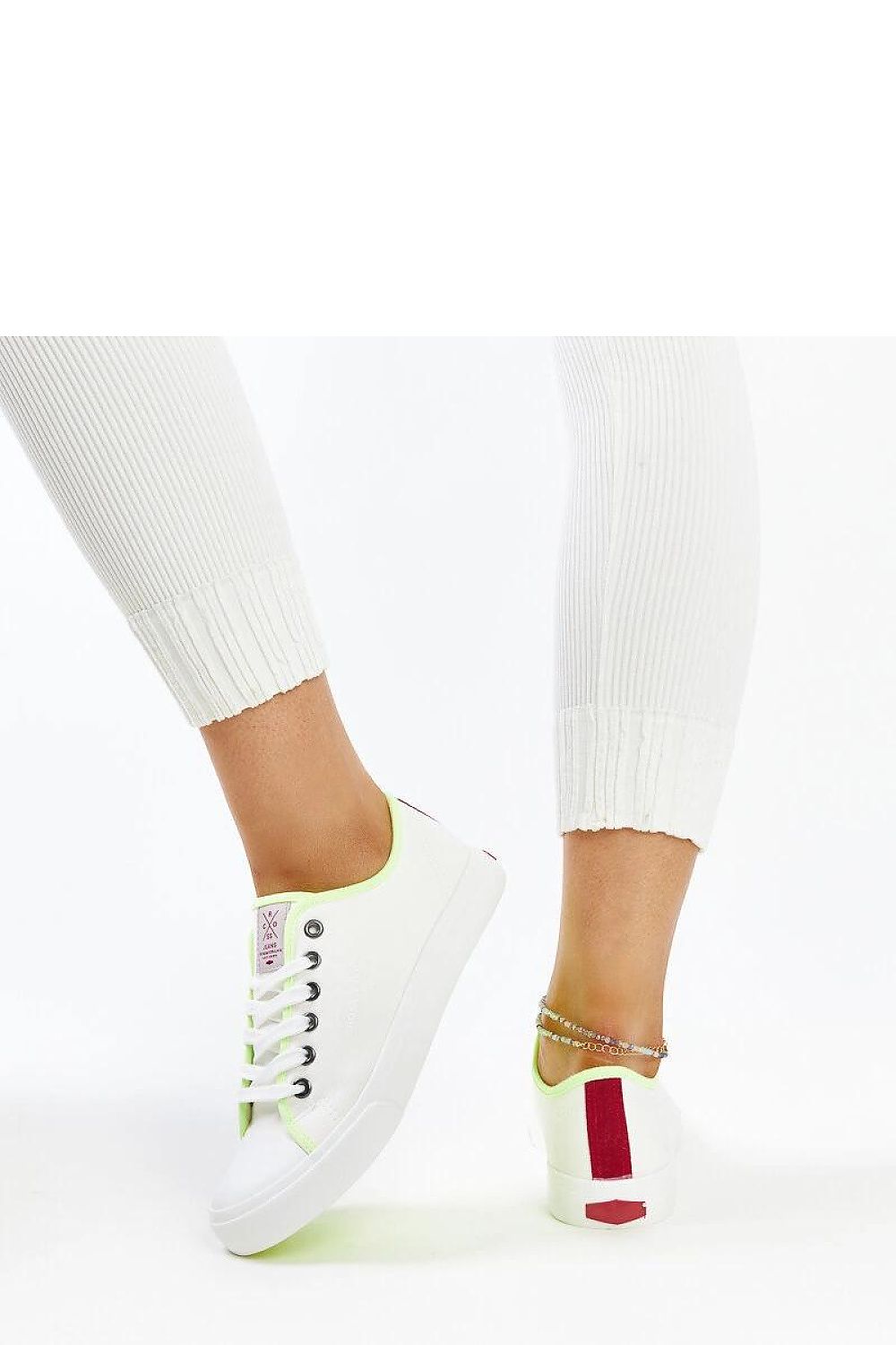 Versatile white lace-up sneakers by Solea, designed for comfort and style, ideal for the contemporary woman, perfect for spring and summer ensembles.