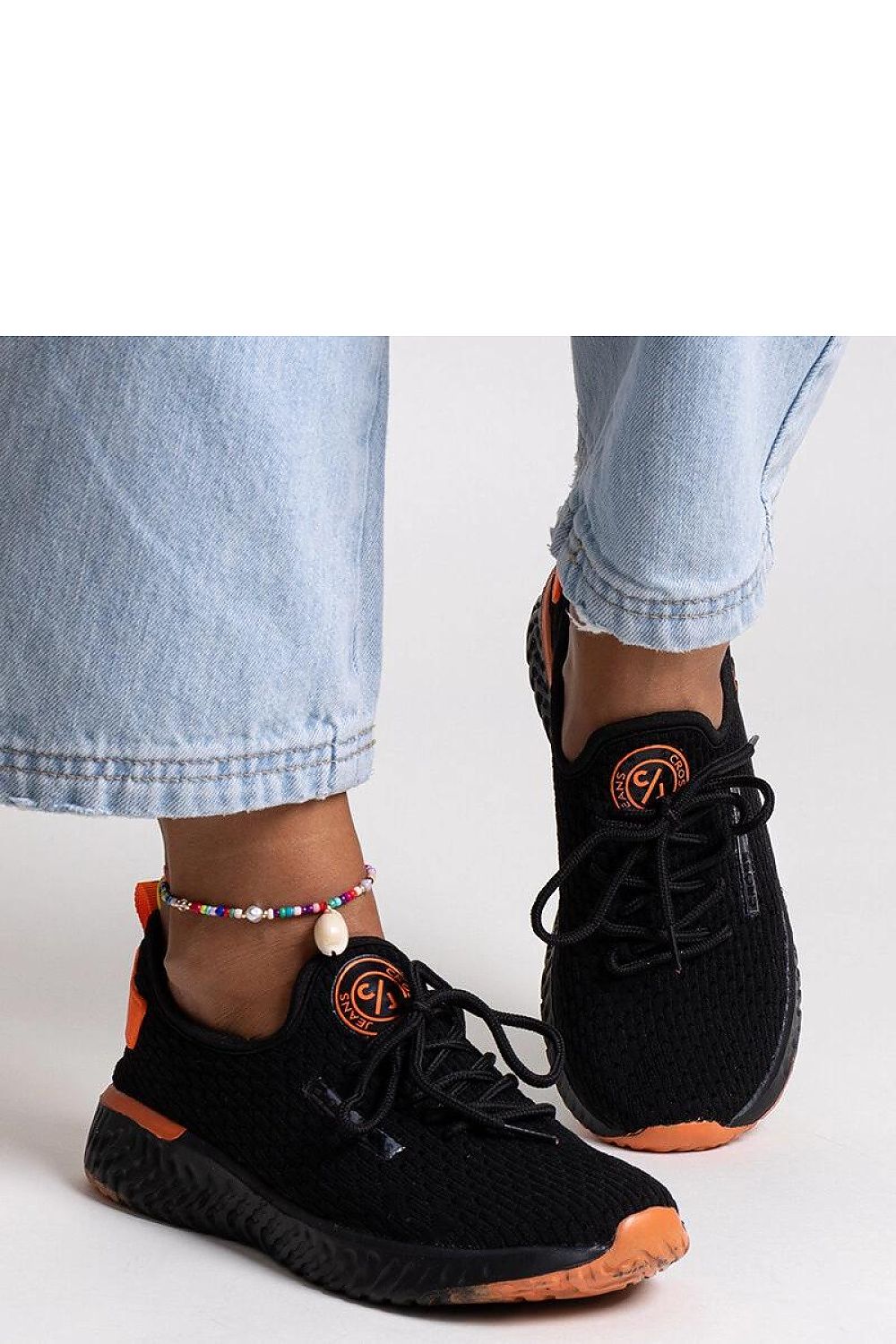 Solea black women's sneakers showcasing a fashionable round toe design and stability, ideal for women who value both comfort and luxury in casual wear.