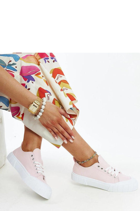 Close-up view of Solea light pink fabric sneakers, showcasing the trendy rounded toe and flexible rubber sole, perfect for comfortable wear.