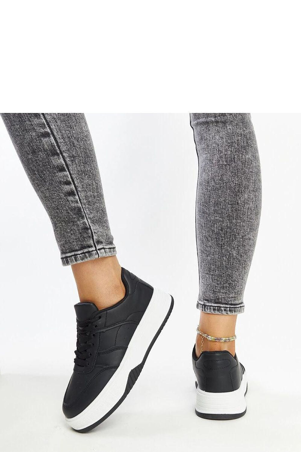 Solea black sneakers showcased on a minimalist background, emphasizing their fashionable appeal and ideal fit for EU sizes 36-41, US sizes 5.5-10.5.