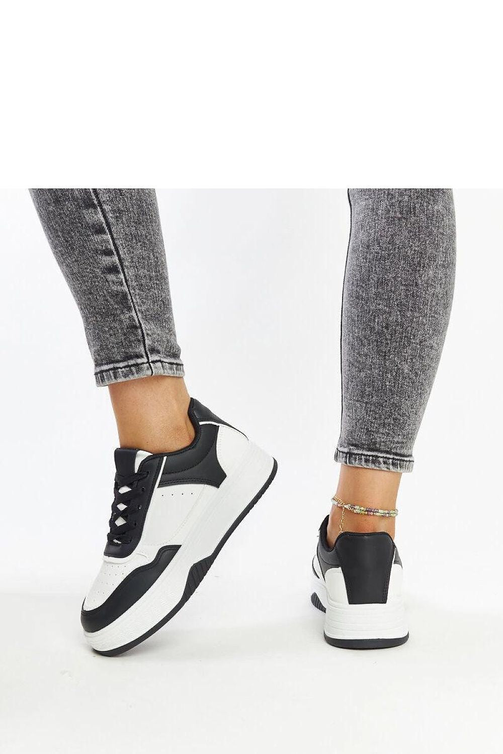 Solea luxury sneakers in a chic black and white colourway, featuring laced closure and eco leather material, ideal for fashion-forward individuals seeking comfort and style.