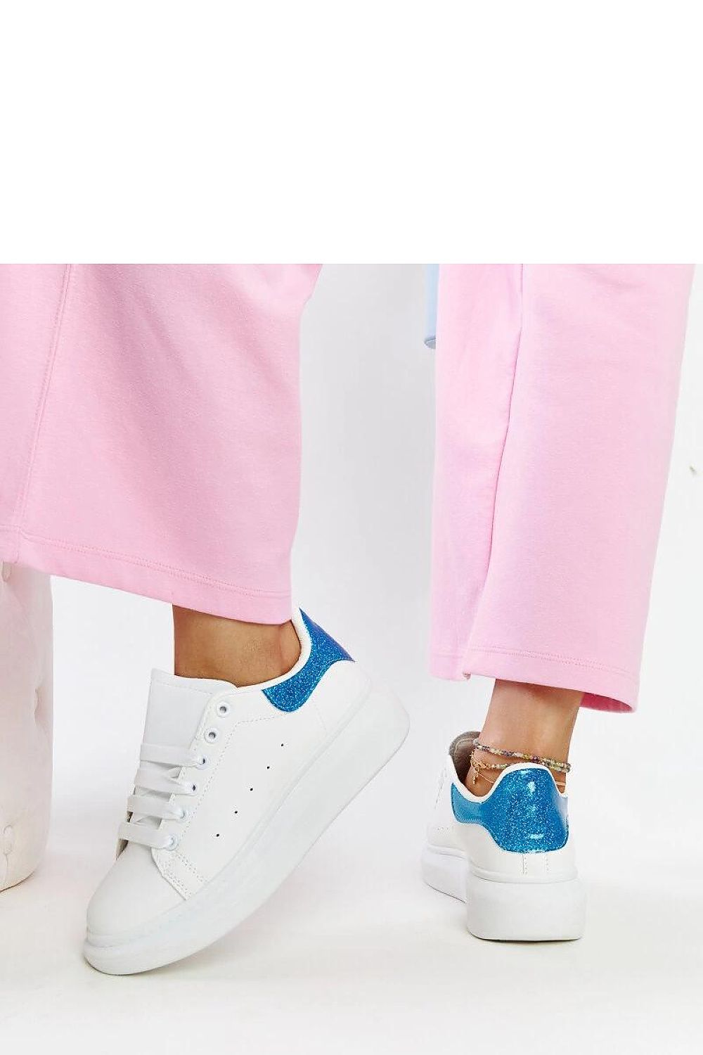 Luxurious white eco-leather sneakers from Solea, the Fatimah style, featuring a summer design with lace-up closure, rubber sole, medium heel, and elegant round toe. Perfect for modern fashionistas looking for comfort and trendy footwear.