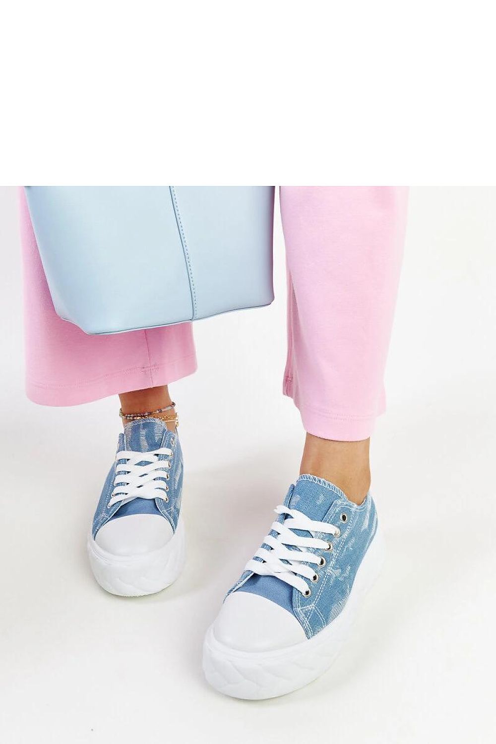 Fashion-forward blue platform sneakers by Solea, featuring a snug lace-up closure for the ultimate fit and stylish appearance.