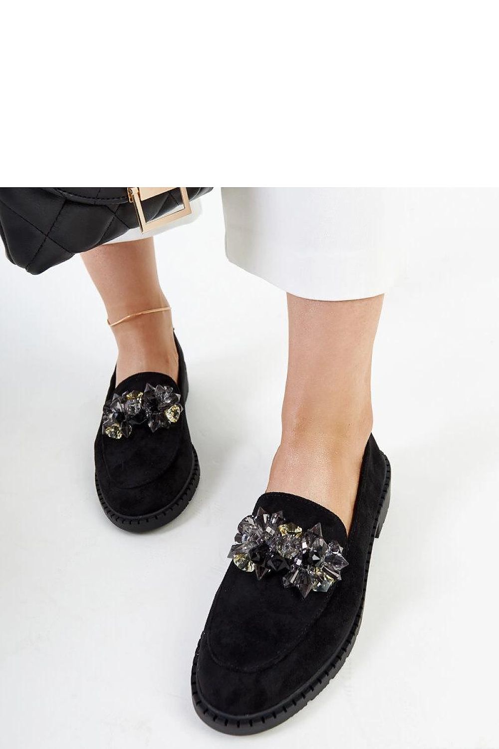 Solea black suede moccasins highlighting a chic design and flexible rubber sole, crafted for elegance and ultimate comfort.
