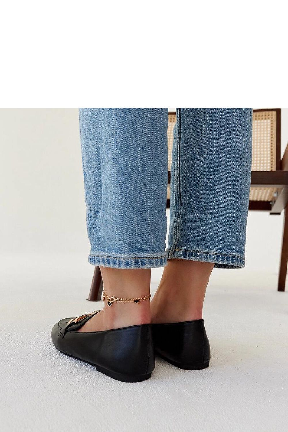 Elegant black moccasin loafers by Solea, showcasing a minimalist design and comfortable fit, the perfect accessory for summer fashion.