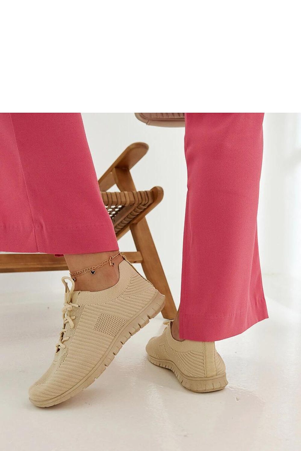 Luxury pink sneakers Erminio by Solea displayed against a summer backdrop, embodying summer fashion and elegance.