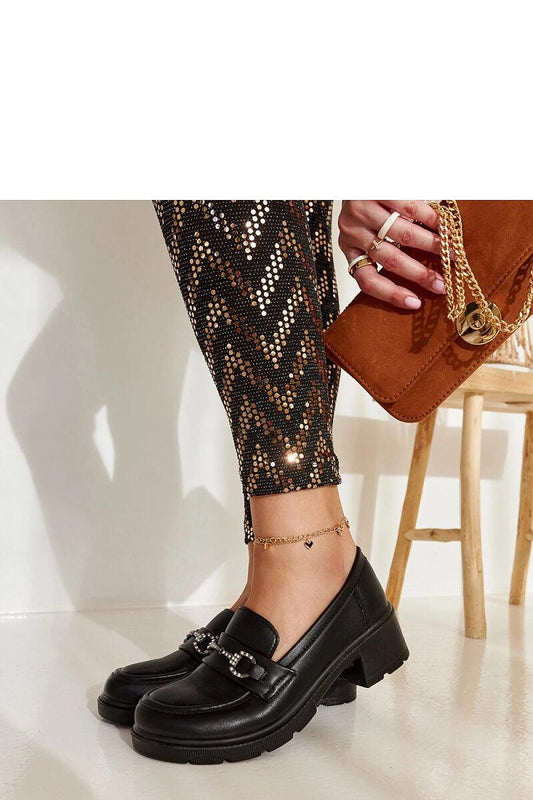 Close-up of Solea's black eco-leather moccasins Grisel, highlighting decorative zircons and round toe for a chic and sophisticated look.