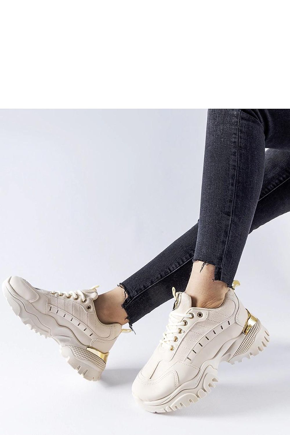 Solea beige sneakers elegantly styled for women, highlighting the chic rubber sole for stability and fashionable casual looks.