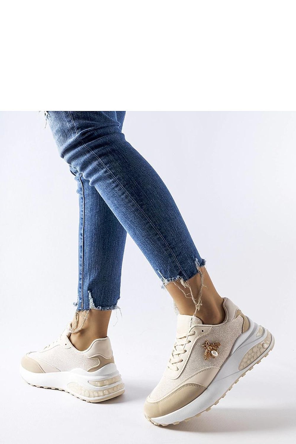 Elegant Solea Acciano eco-leather sneakers in brown and white, featuring decorative stitching and a comfortable lace-up design, perfect for stylish spring and summer outings.