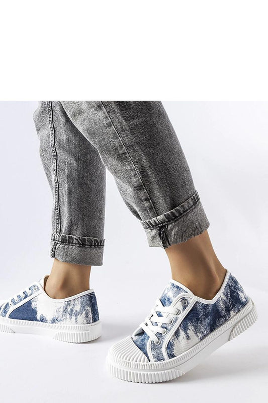 Close-up of Clavet women's blue sneakers, highlighting the high-quality rubber material and laced detailing for a comfortable fit.